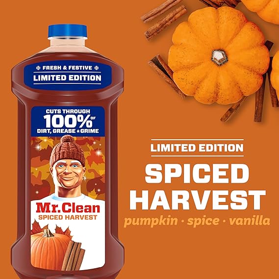 Mr. Clean Spiced Harvest cleaning product with pumpkins and cinnamon sticks on an orange background